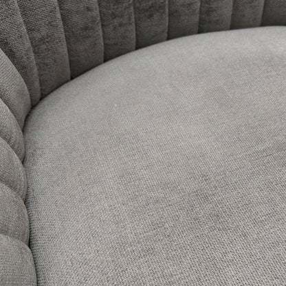 Close-up view of the dark grey fabric texture and the matt black legs.