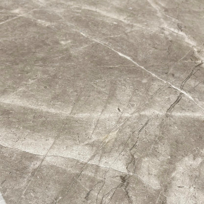 Close-up view of the natural, unique veining pattern on the solid marble rectangular tabletop of the Empire dining table.