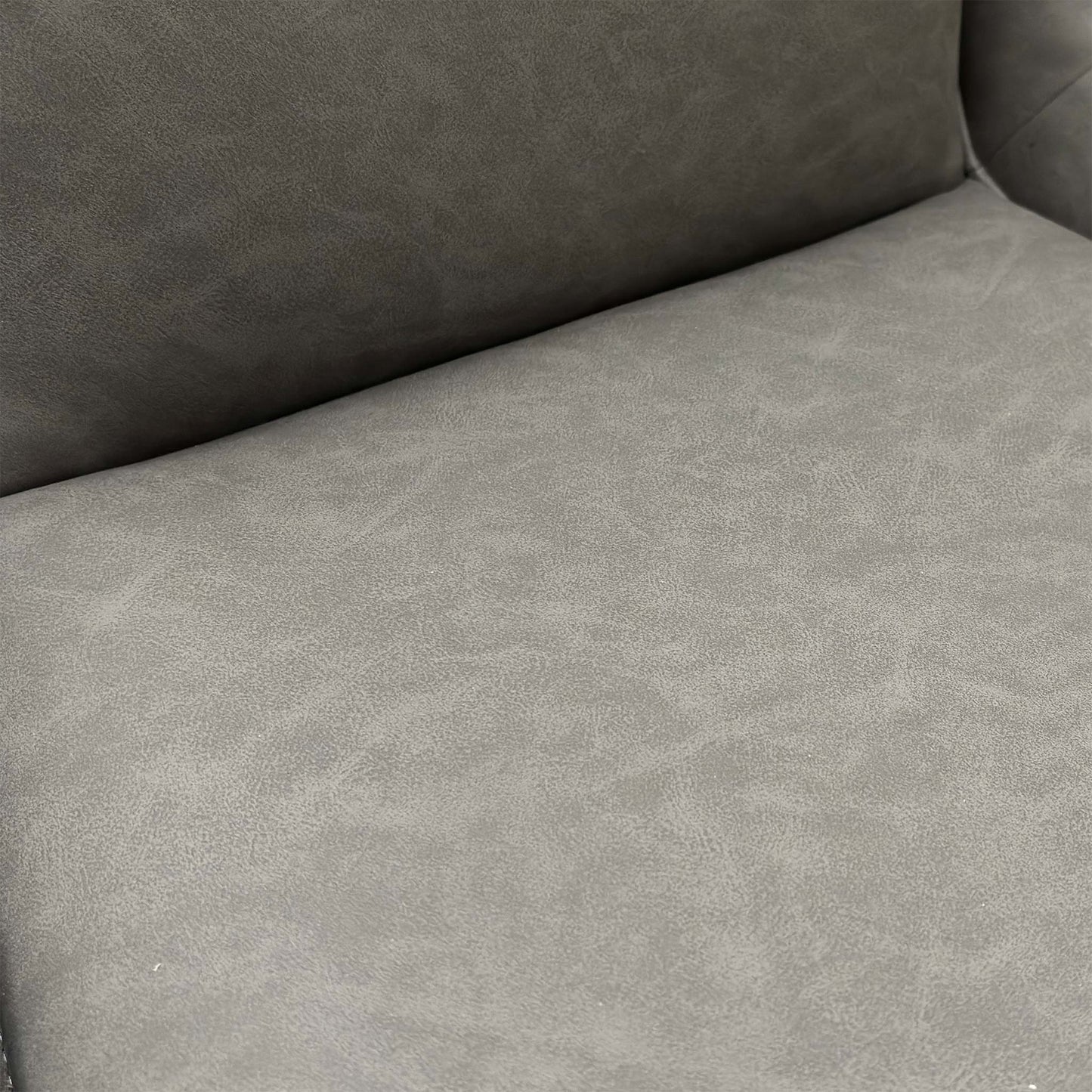 Close-up view of the swivel base and the matt black powder-coated metal legs.