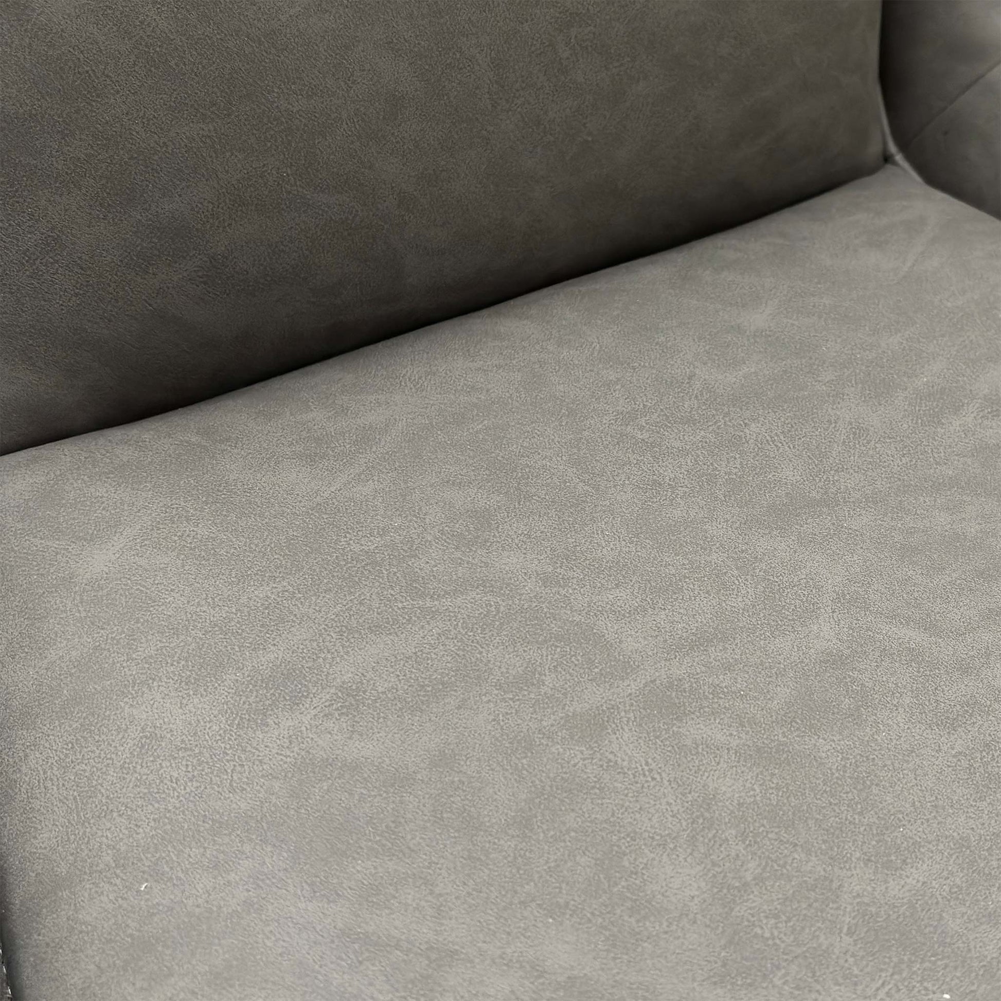 Close-up view of the swivel base and the matt black powder-coated metal legs.