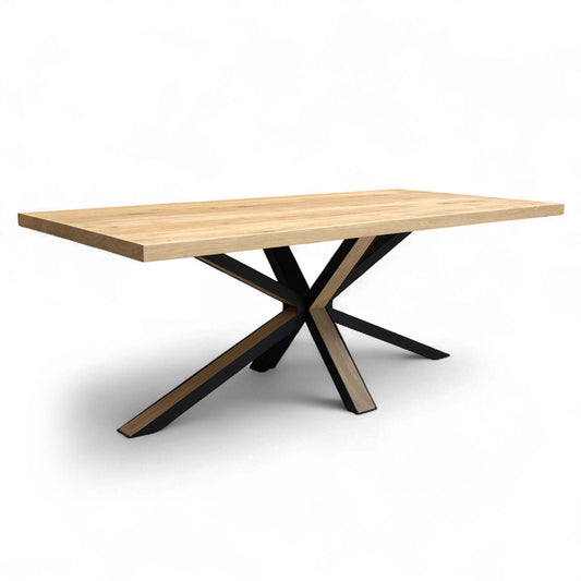 Angled view showing the natural wood tabletop and the starburst leg assembly.