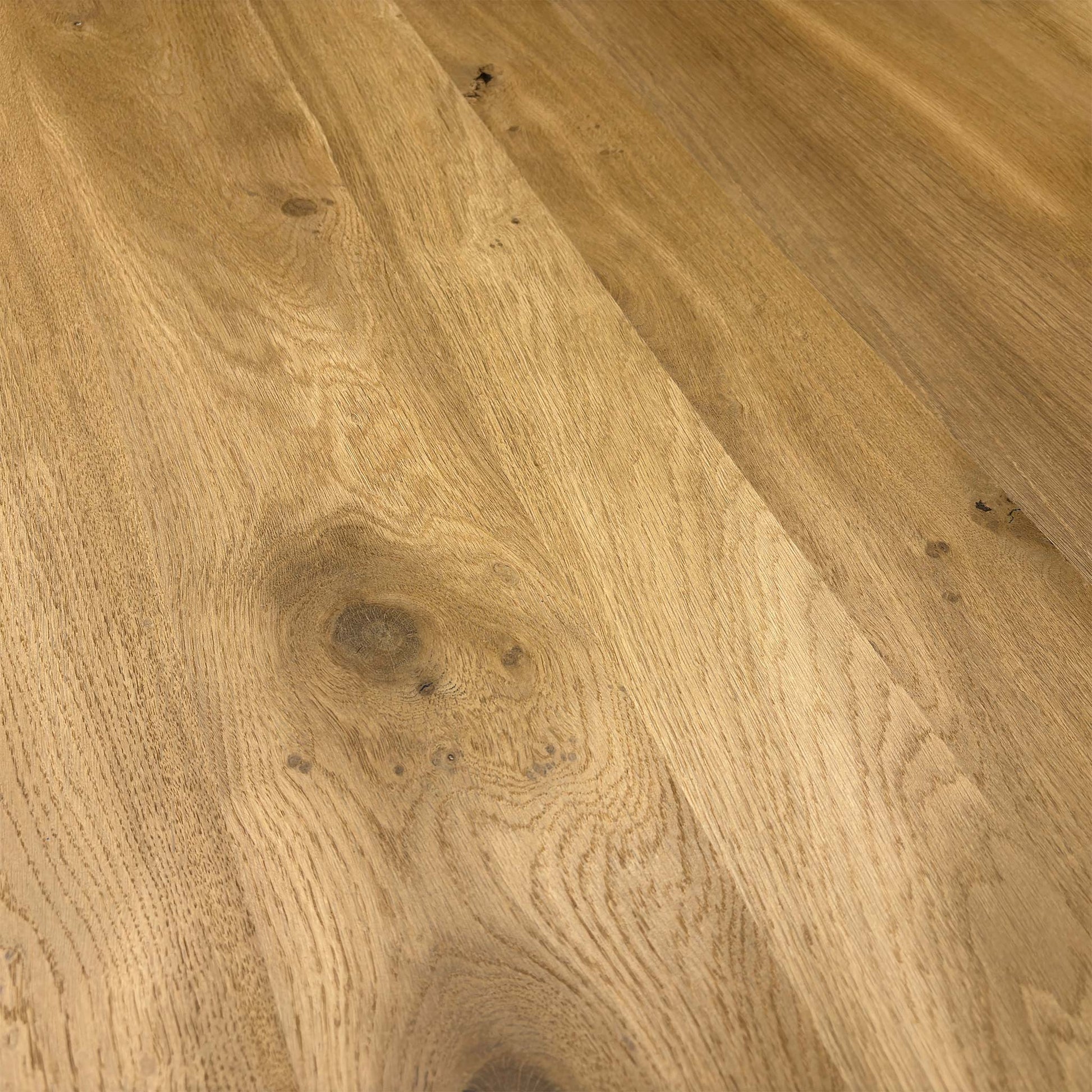 Close-up of the table surface and the meeting point of the legs and tabletop.