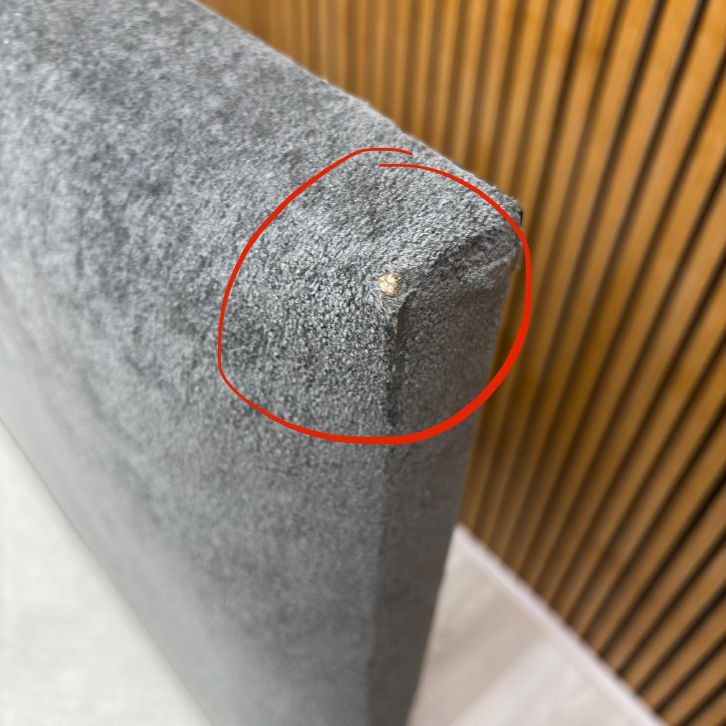 Close-up image showing damage/defect on the Arctic Grey velvet headboard (Note: Always include relevant condition notes for outlet/damaged items).