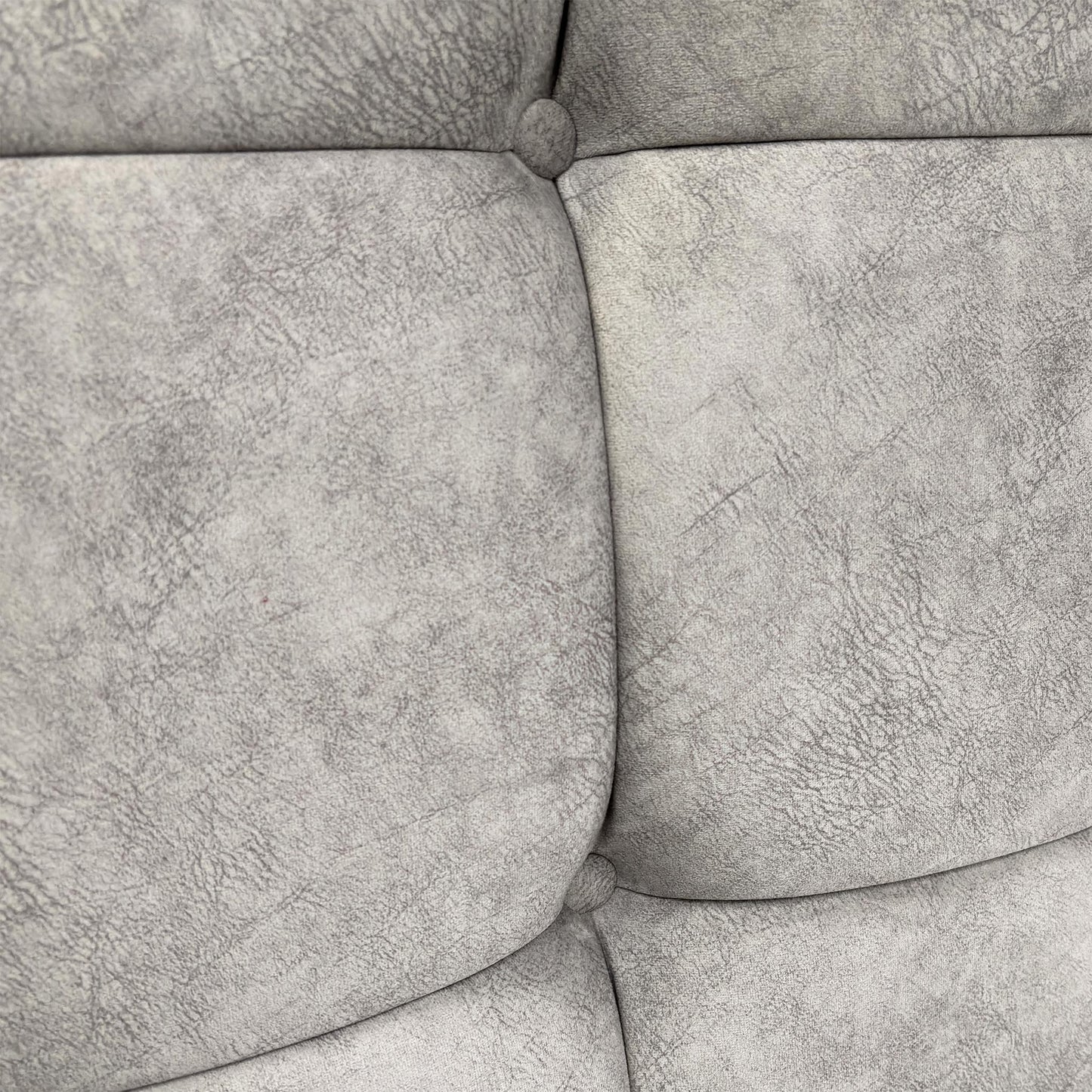 Close-up of the headboard's button-tufting detail.