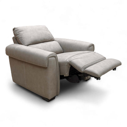 Angled side view of the Nixon Power Recliner, highlighting the generous padded arms and headrest, and the soft taupe suede upholstery.
