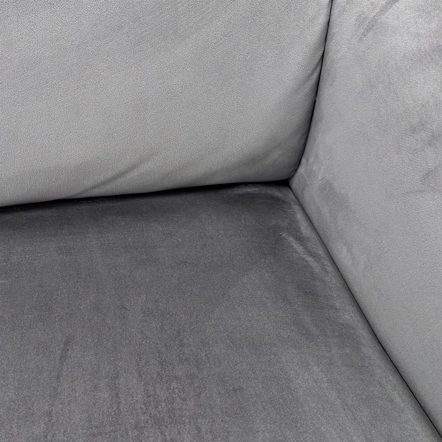 Close-up detail of the Bluish Grey Velvet upholstery on the sofa, showing the luxurious texture and stitching.