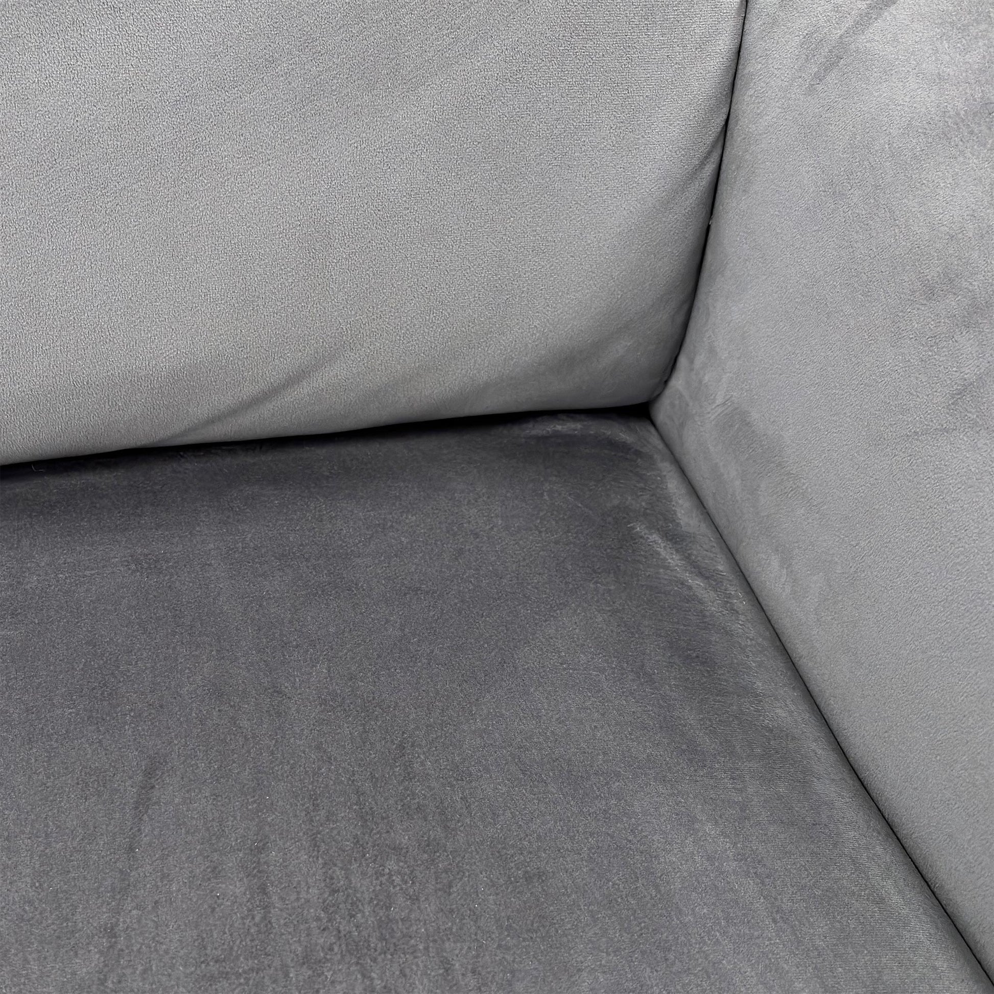 Close-up detail of the Bluish Grey Velvet upholstery on the sofa, showing the luxurious texture and stitching.