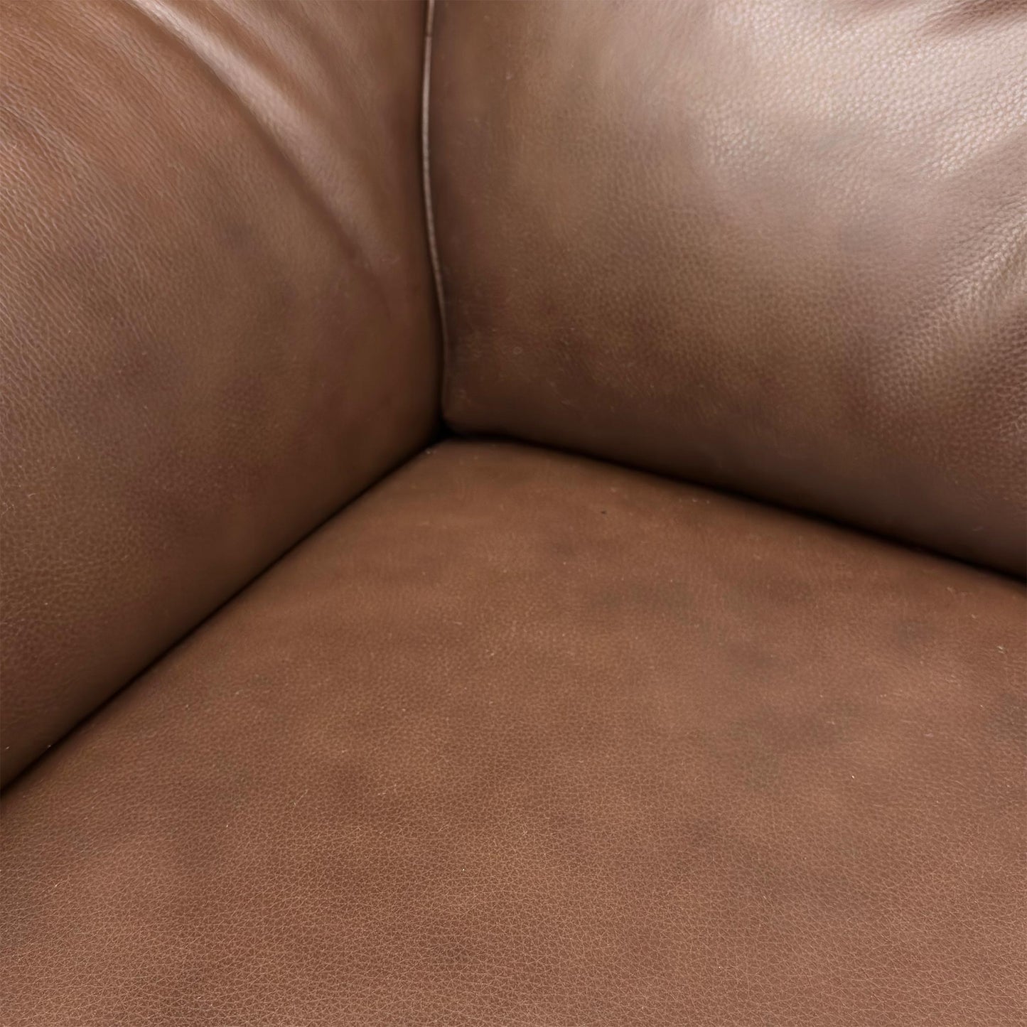highlighting discoloration or a specific imperfection on the Daytona Sofa Set. (Condition note: Damage visible)
