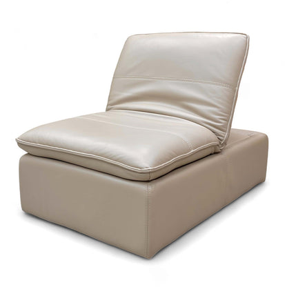 Side profile of the Pebble Cream Leather Footstool, showing its depth and modern silhouette.