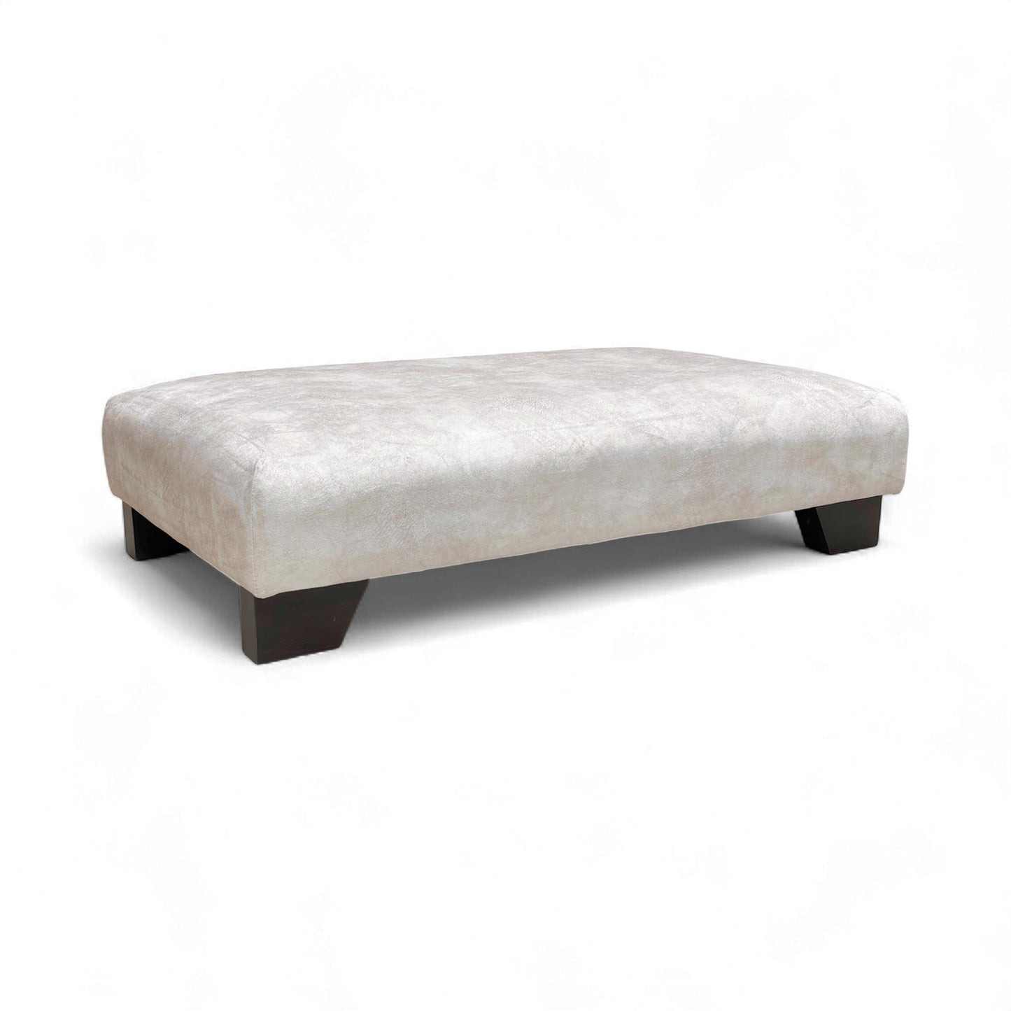 The Boutique 'Aura' Kenzo Cream Designer Footstool, showcasing its glamorous velvet upholstery and wood feet.