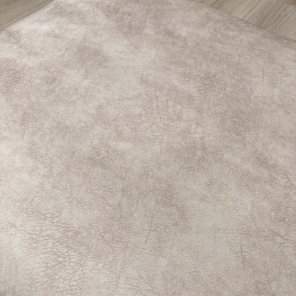 Detailed close-up of the Cream Velvet fabric of the 'Aura' footstool, emphasizing its sophisticated texture.