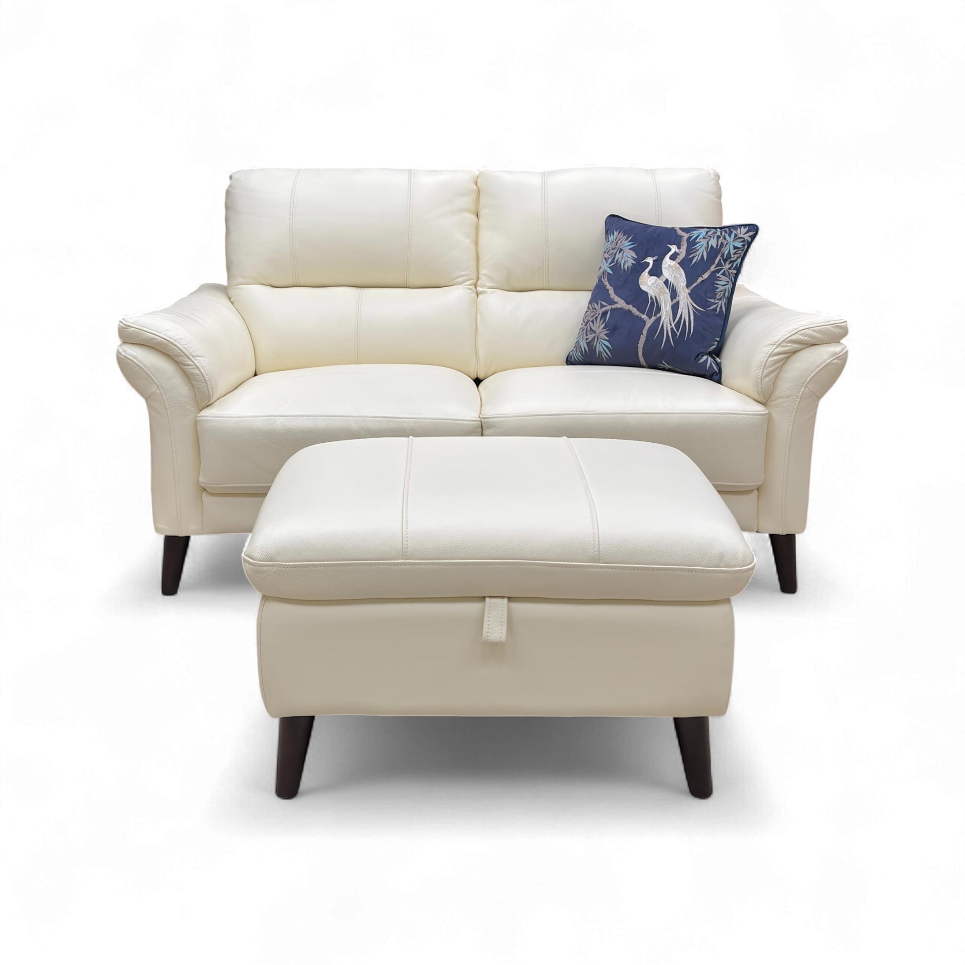 Front view of the 2 Seater Sofa and Storage Footstool with a pillow.