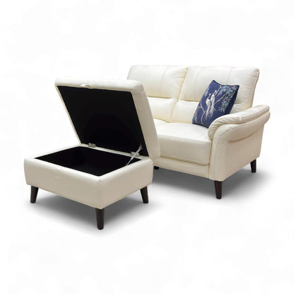 Close-up of the matching Storage Footstool with the lid ajar, revealing the interior storage space.