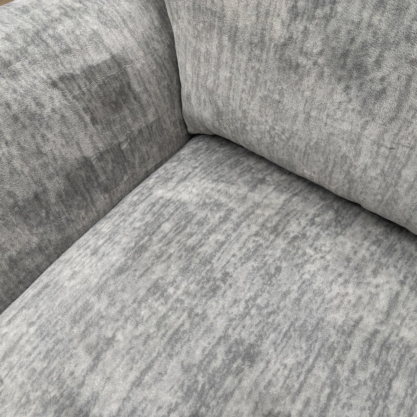 Close-up of the fabric texture and scatter cushions.