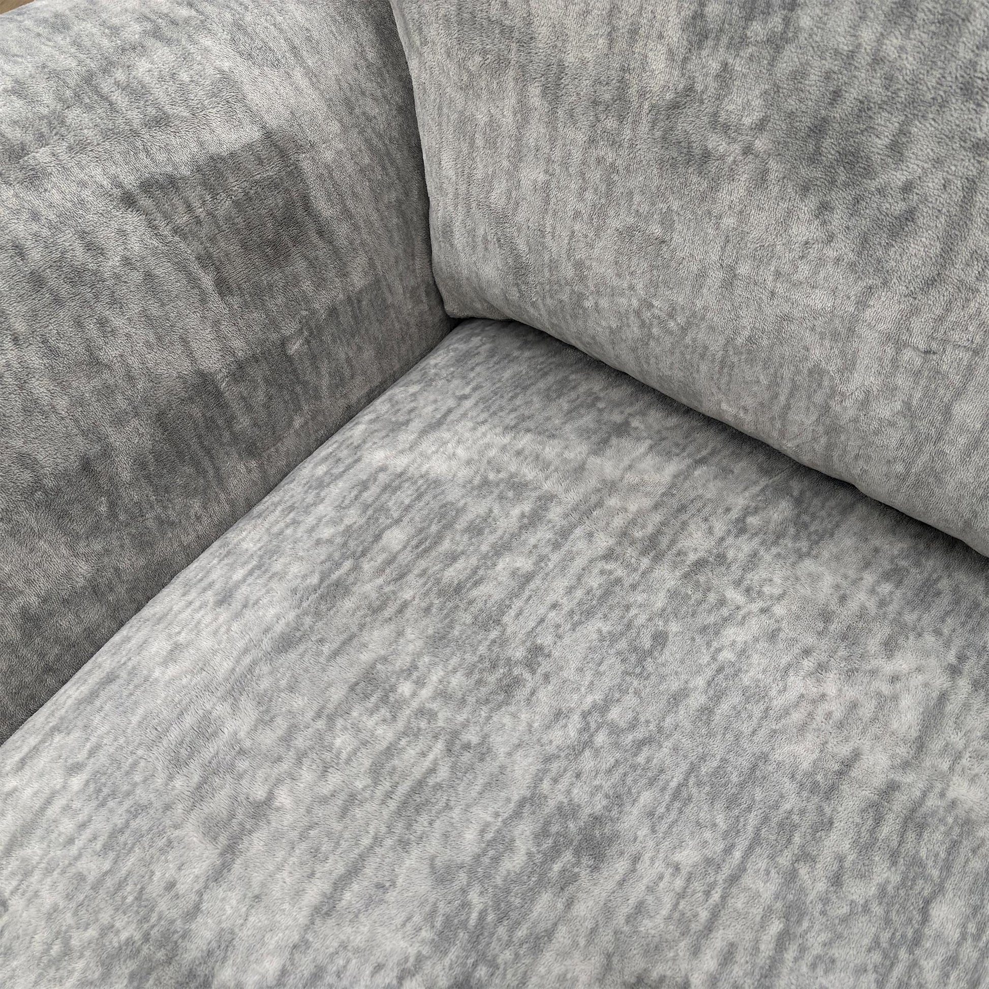 Close-up of the fabric texture and scatter cushions.