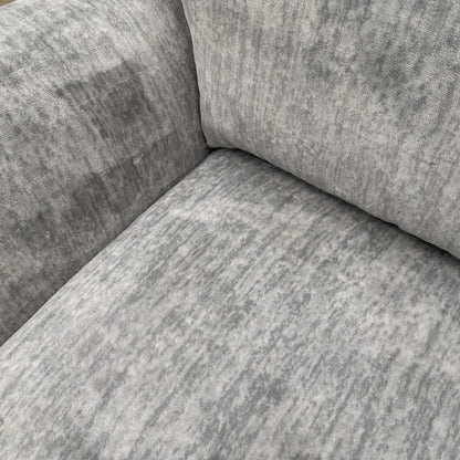 Close-up of the fabric texture and scatter cushions.
