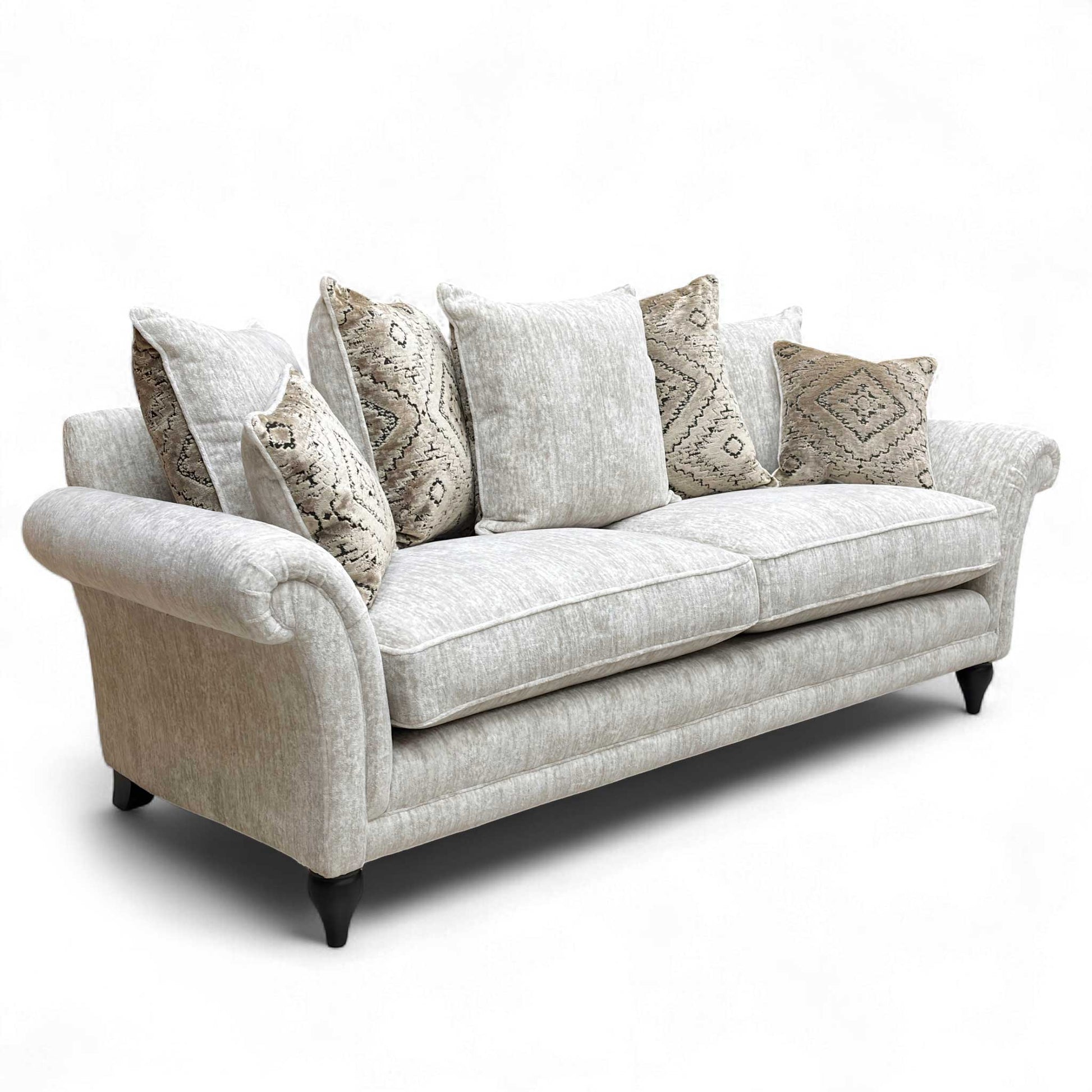 Angled view of the large 'Plaza' Grande Sofa, highlighting its generous depth and comfort with a full array of feather-filled cushions.