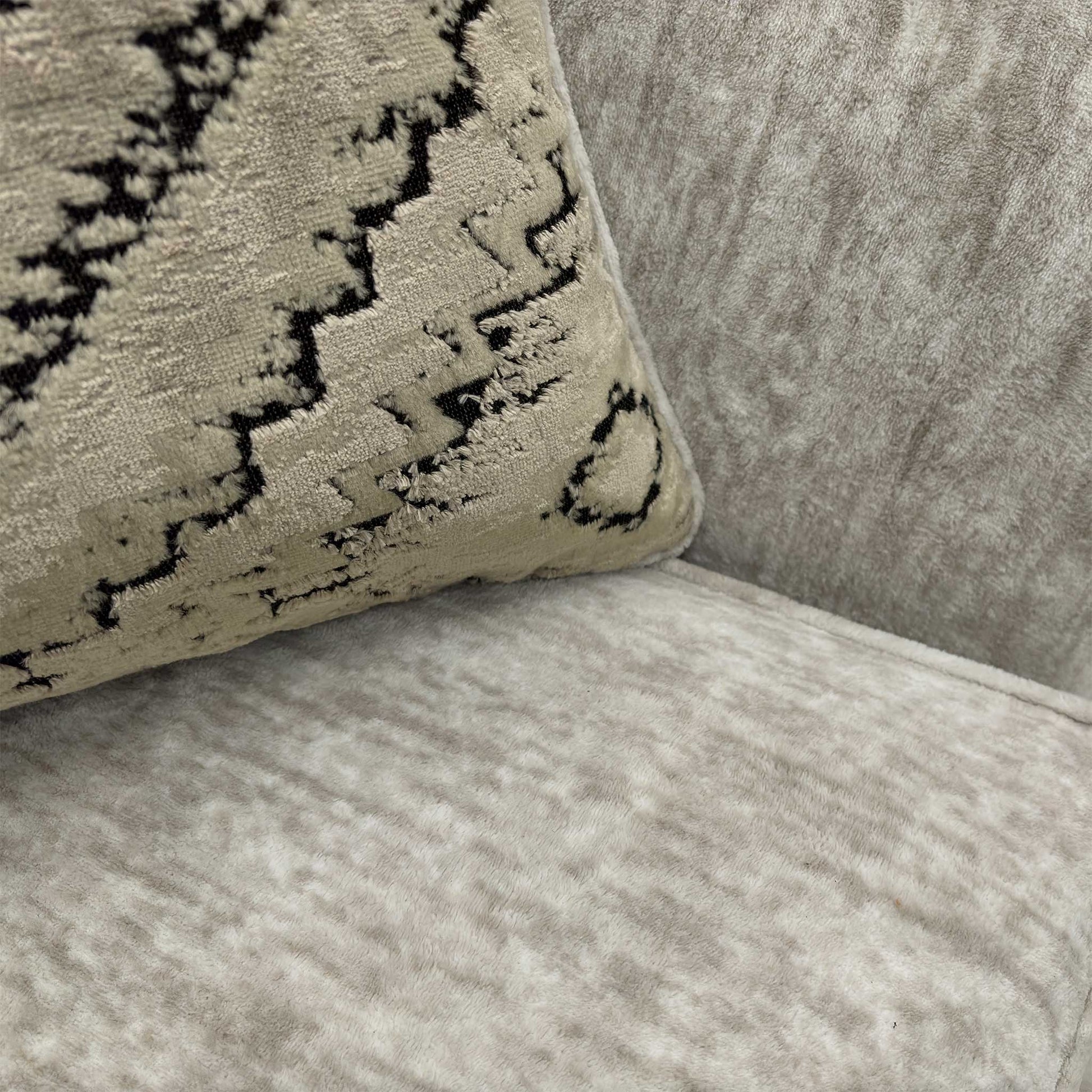 Detailed close-up of the Mink Fur Velvet upholstery and the combination of the 5 large and 2 small feather-filled scatter cushions.