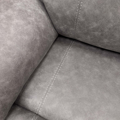 Angled close-up view of the fabric and armrest.