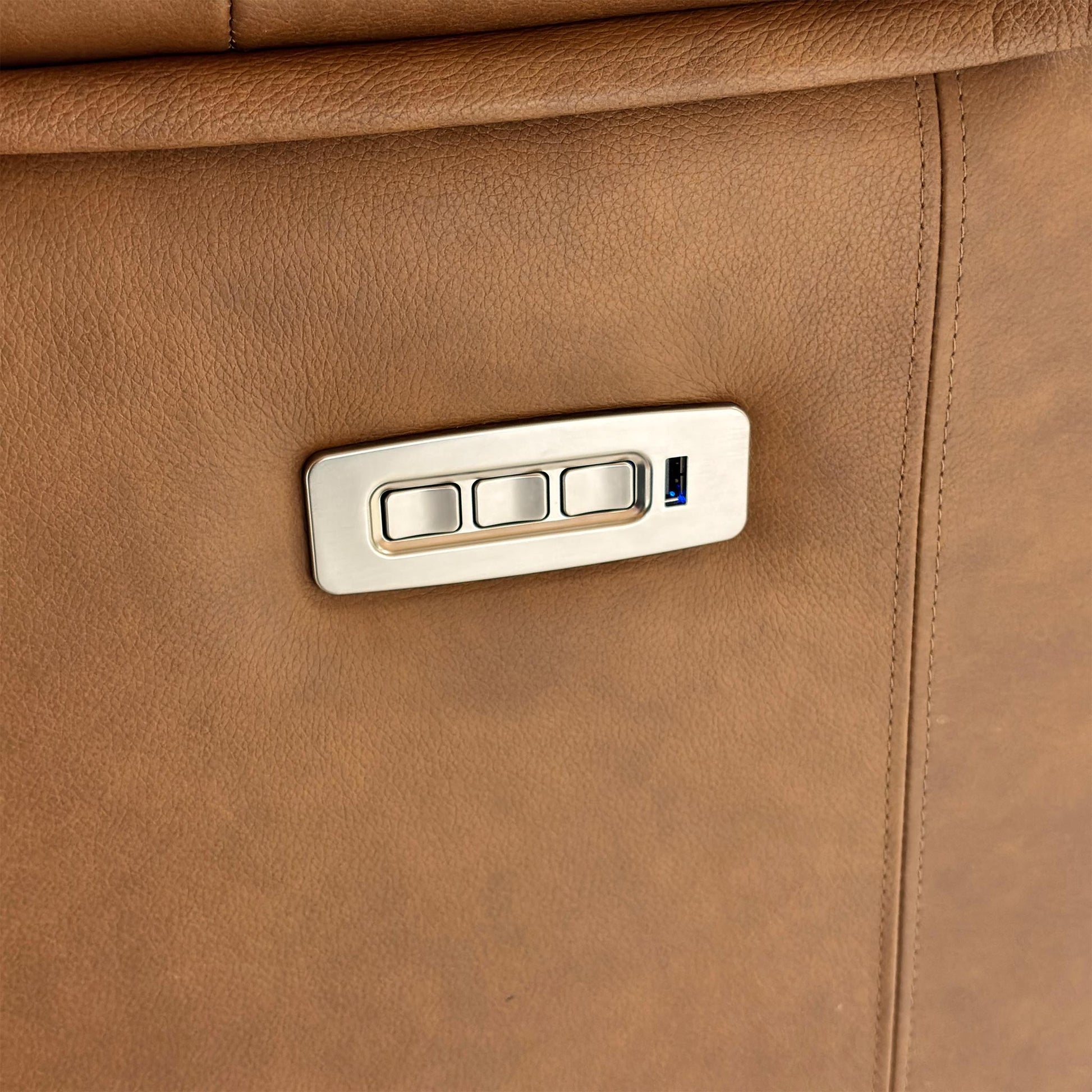 Detailed view of the power controls for the reclining function, headrest, and lumbar on the 'Kingsbury' chair.