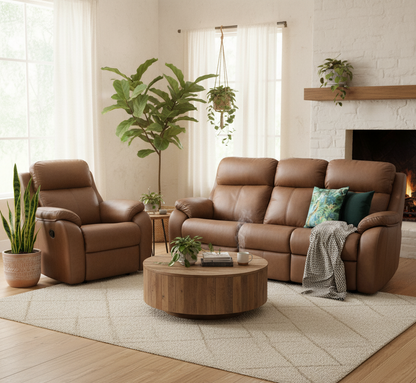 Living room with brown leather sofa and armchair, wooden coffee table, and decorative plants.