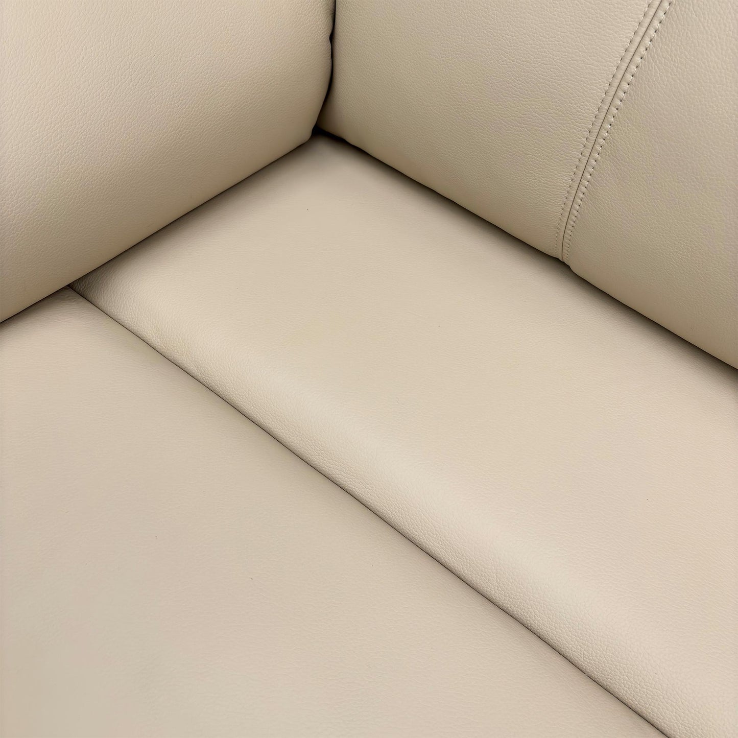 Close-up of the leather texture and arm design.