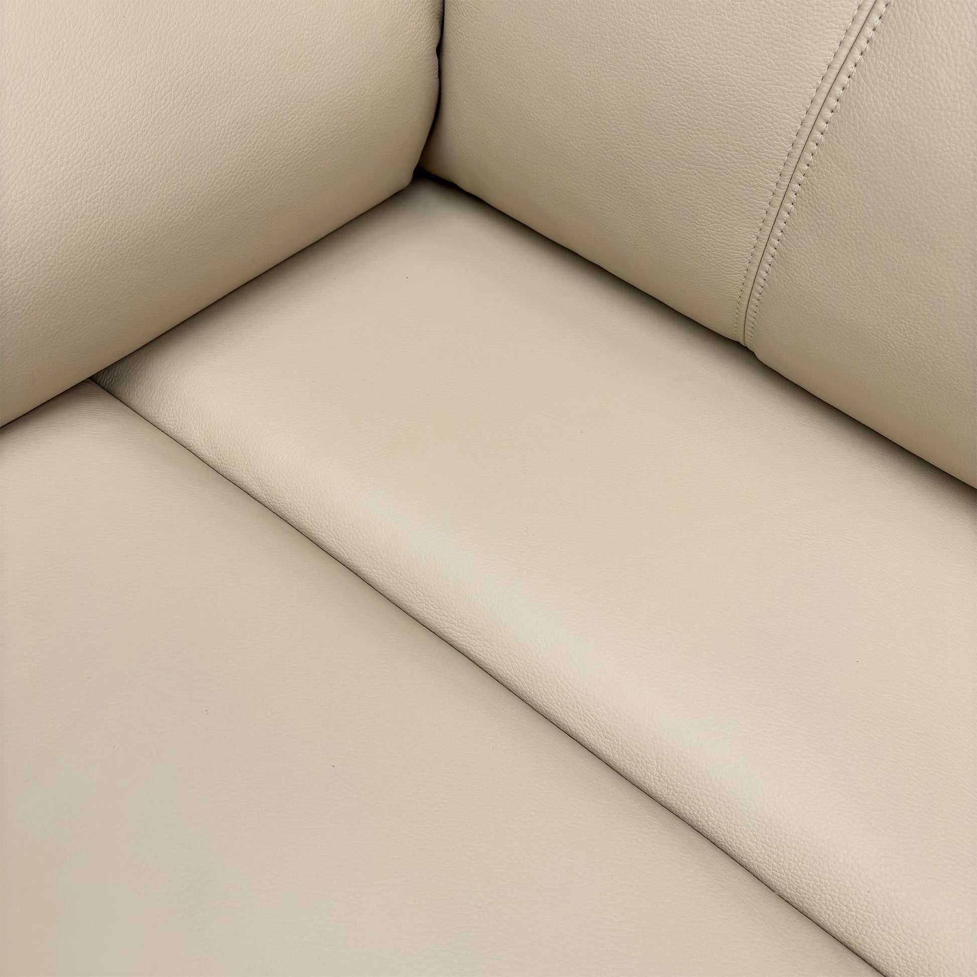 Close-up of the leather texture and arm design.