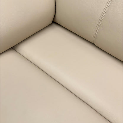 Close-up of the leather texture and arm design.