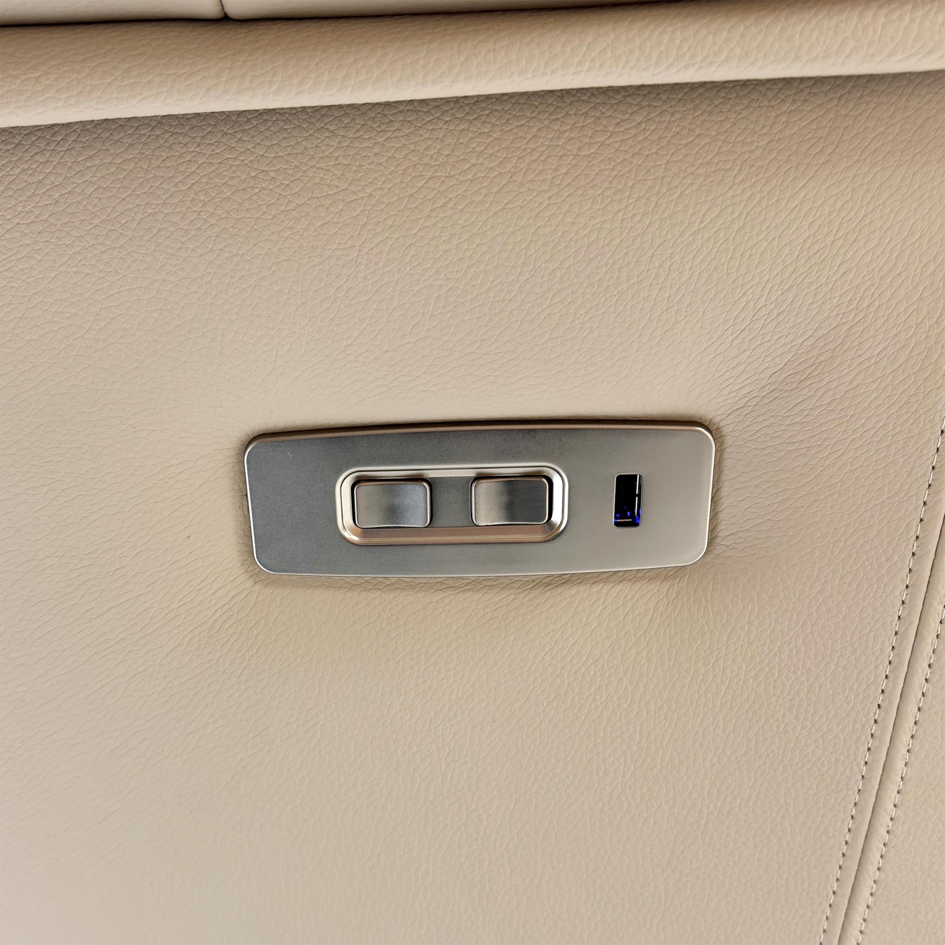 Close-up of the power recliner button on the chair.