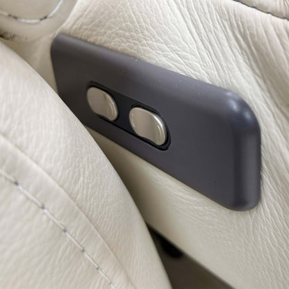 Close-up of the power controls discreetly located on the sofa's padded arm, ready to activate the recliner and headrests.