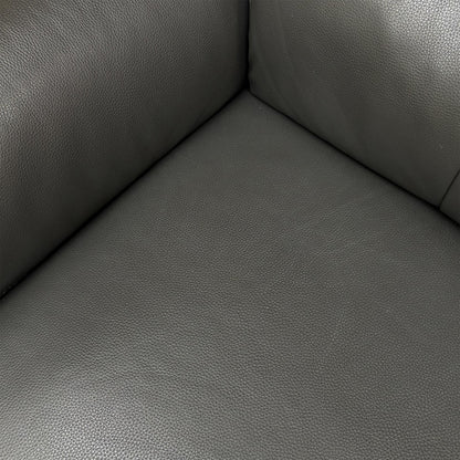 Detailed close-up of the 100% real leather upholstery in Storm Grey, emphasizing its quality and texture.