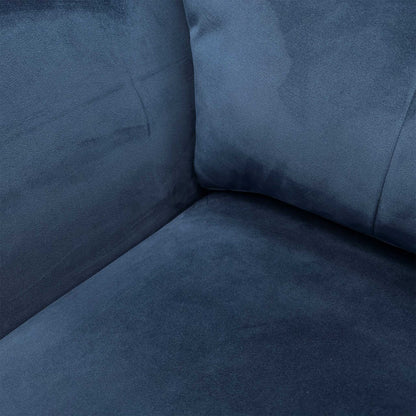 Close-up of the velvet fabric texture and cushion detail.
