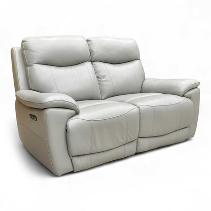Angled view showing the sofa with one seat in a partially reclined position.