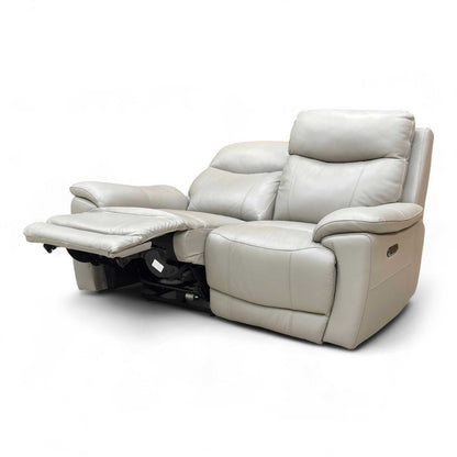 Angled view showing the Power Recliner mechanism activated, highlighting the extension of the footrest for superior comfort.