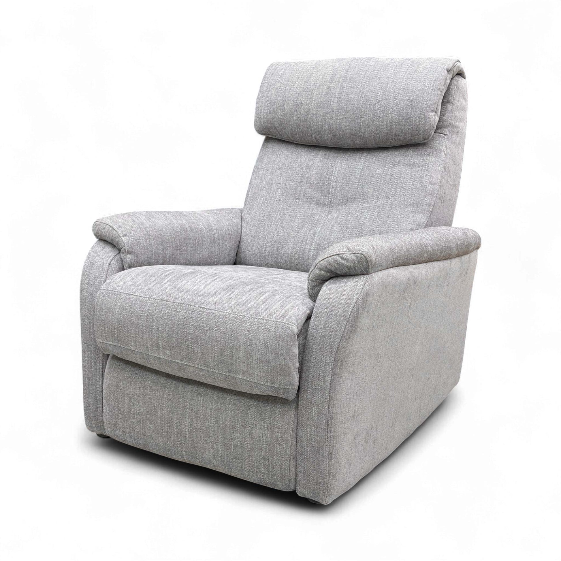 Angled view of the Mid Grey Swivel Rocker Recliner, highlighting the chair's rounded shape and substantial size.