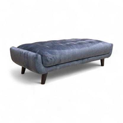 Side profile of the Granite Grey Rectangular Footstool, showing the black legs.
