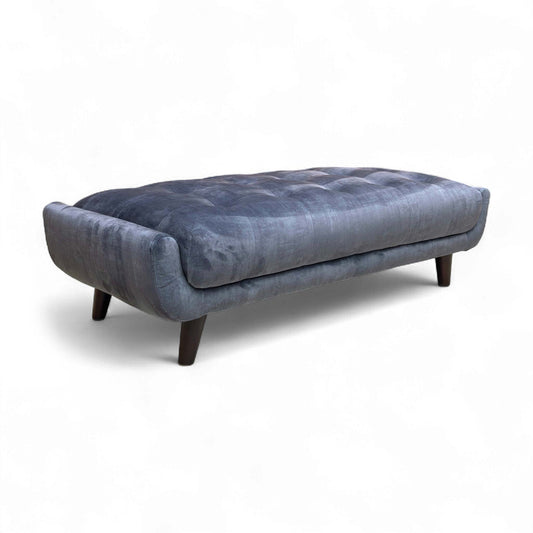 Side profile of the Granite Grey Rectangular Footstool, showing the black legs.