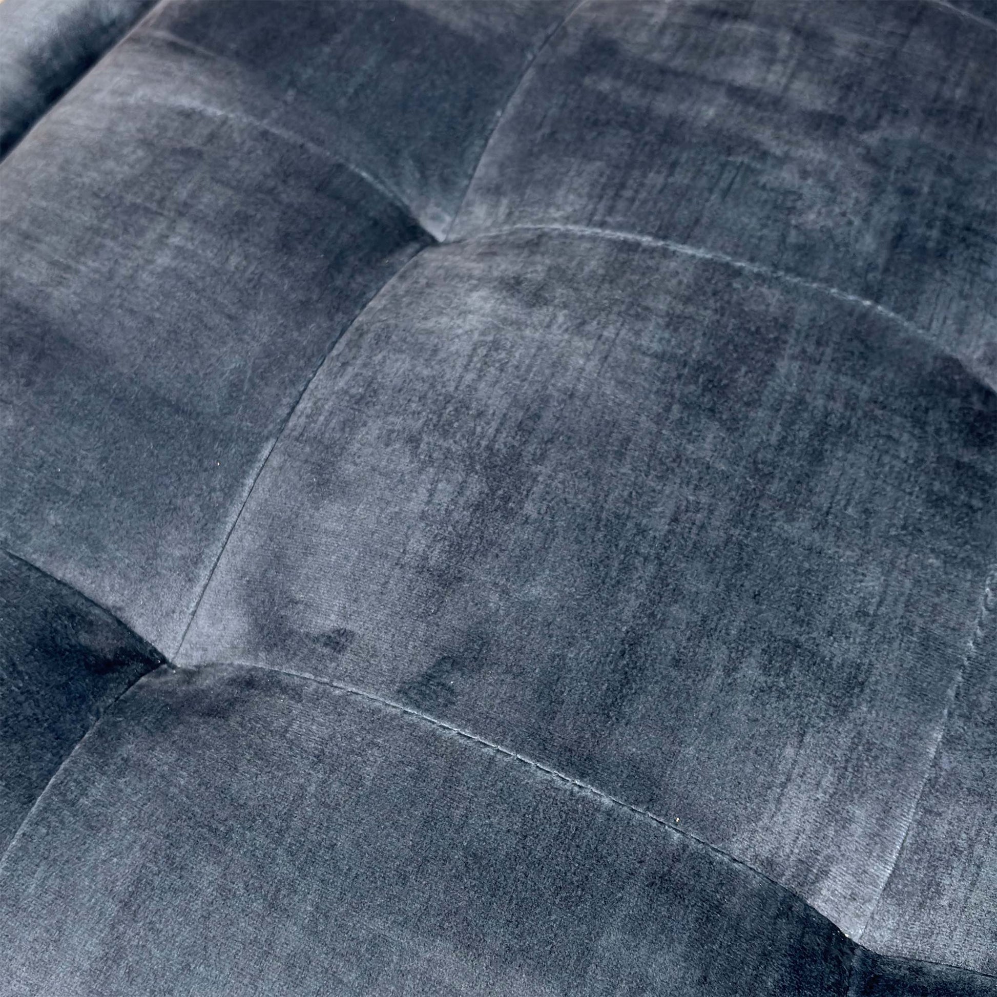 Close-up of the fabric and surface detail.