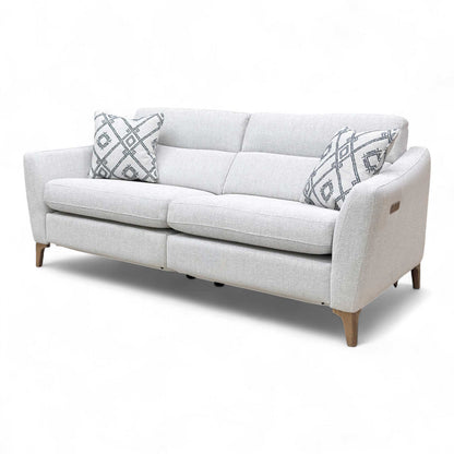 Side-angle view of the Moderna Power Recliner Sofa with its full depth and cushioned armrest visible.