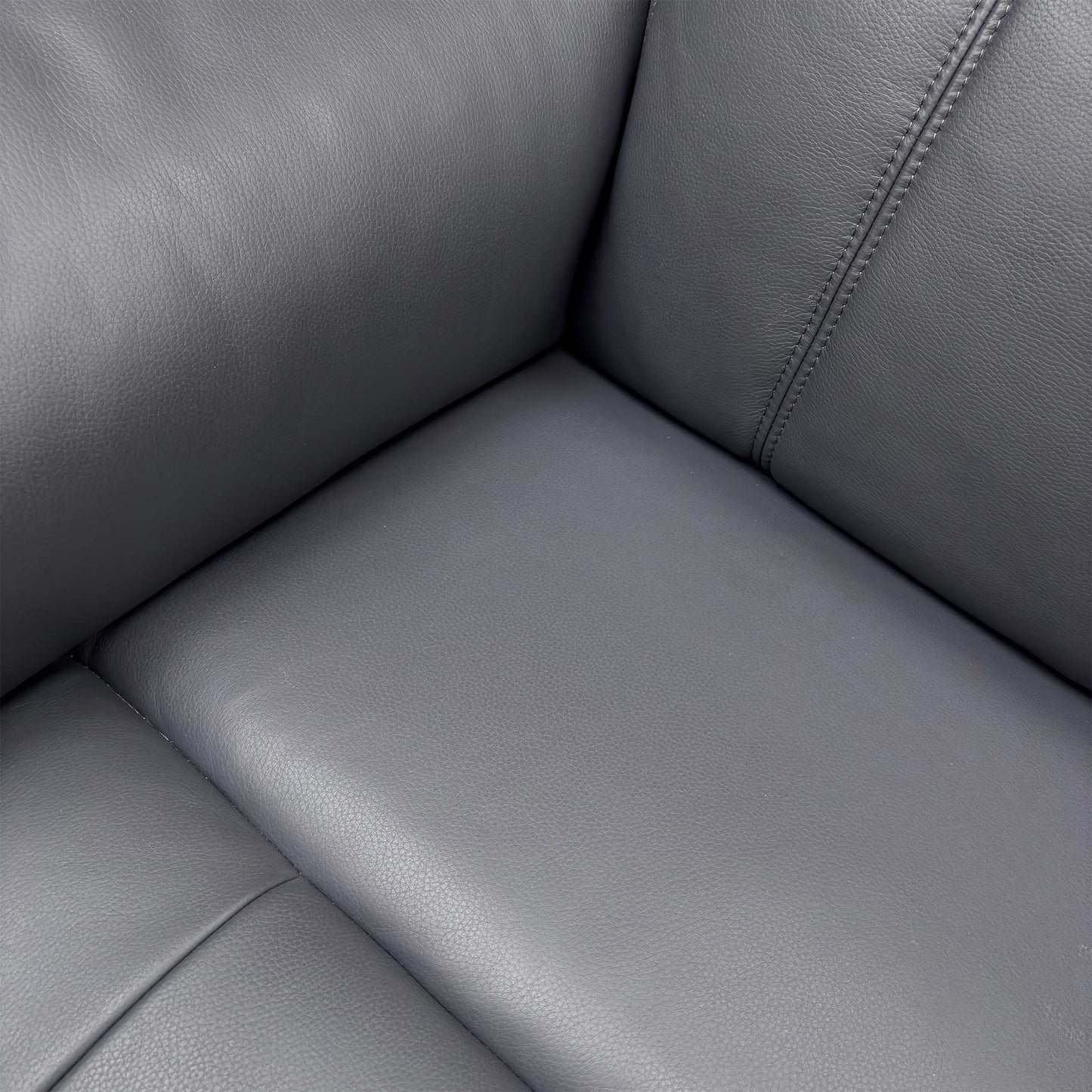Close-up detail of the Navy Leather upholstery and stitching, showing the Cat-60:24 grade.