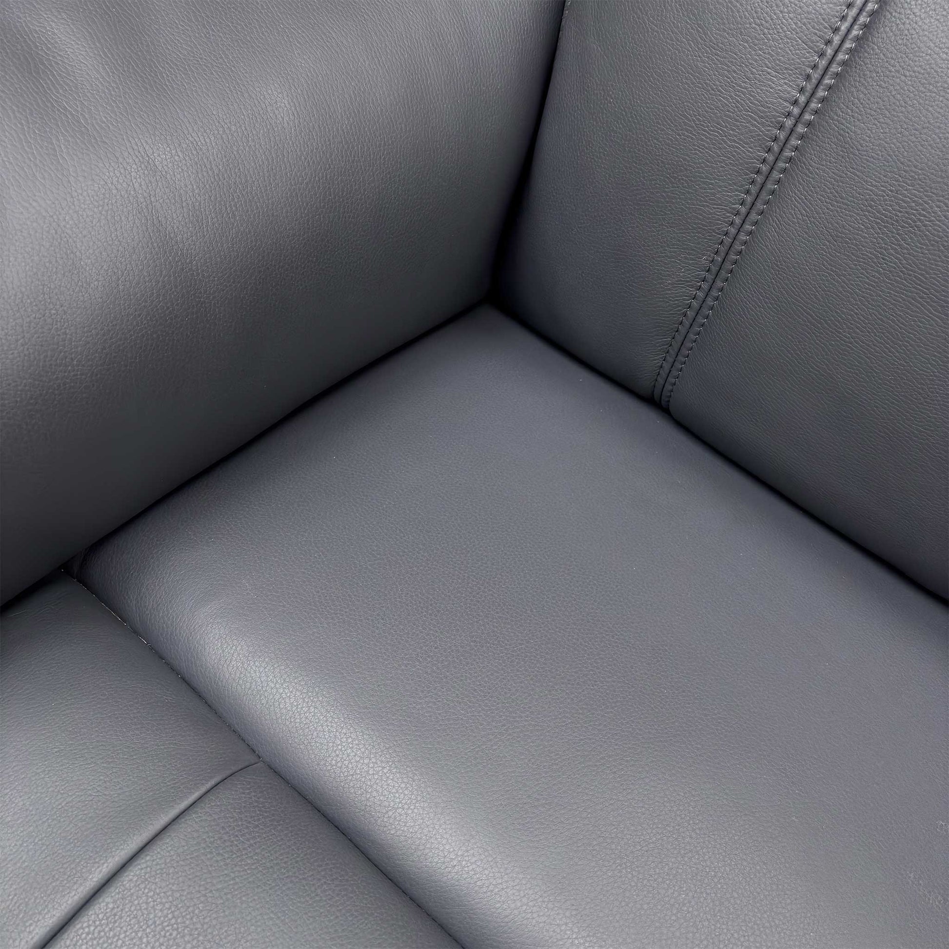 Close-up detail of the Navy Leather upholstery and stitching, showing the Cat-60:24 grade.