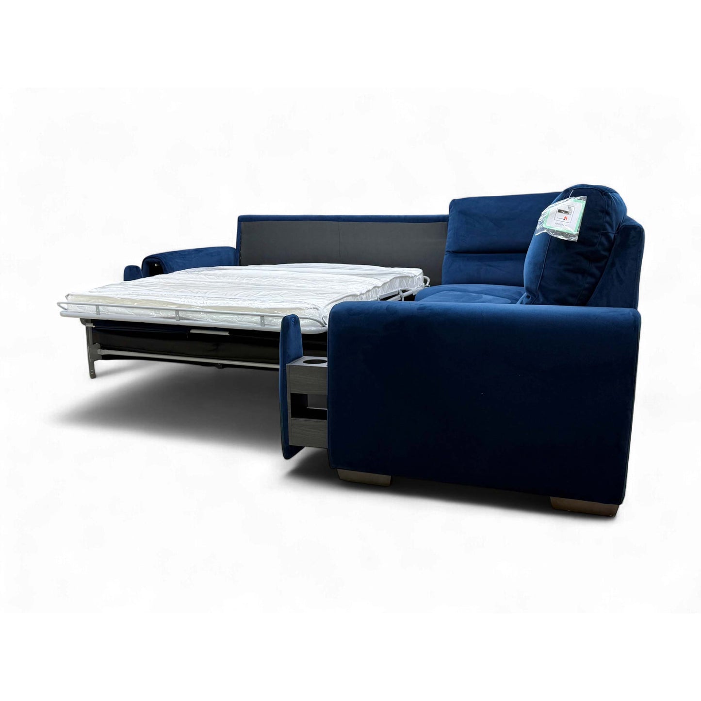 The Navy Velvet Corner Sofa with the end seat's Power Recliner fully extended for comfortable lounging.