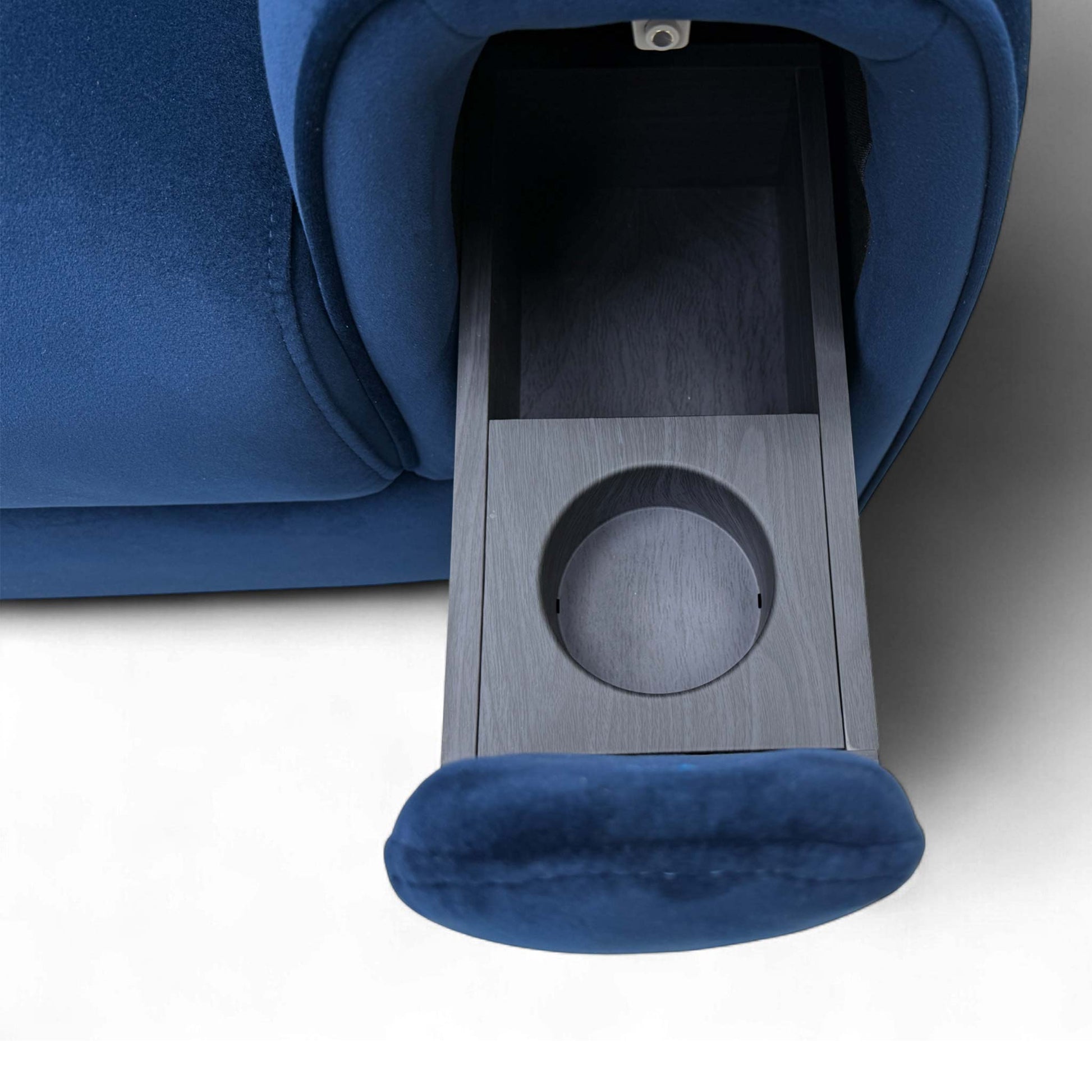 View of the modern, wide rounded armrests, which conceal the integrated storage and cup holders.