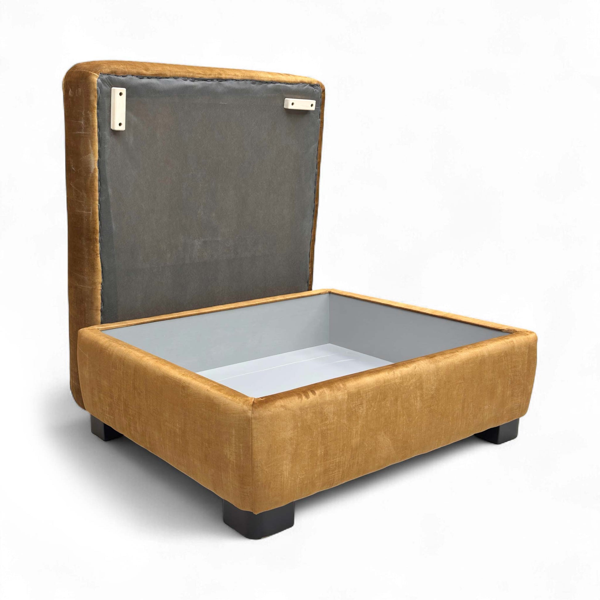 The footstool with the lid open, revealing the storage compartment.