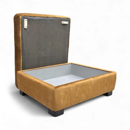 The footstool with the lid open, revealing the storage compartment.