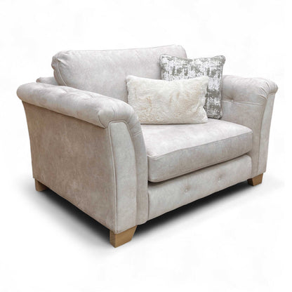 Angled view showcasing the generous size and depth of the Cream Love Chair, ideal for two.