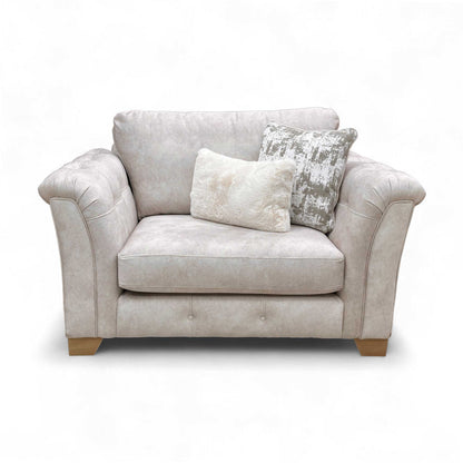 Full view of the Boutique 'Aura' Love Chair in Kenzo Cream Fabric, featuring a buttoned border and rolled arms.