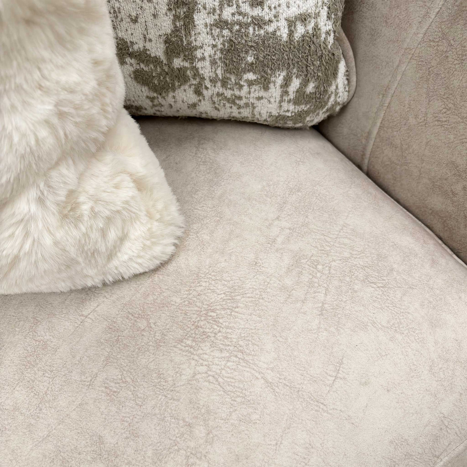 Close-up detail of the beautifully rolled arm and the Kenzo Cream fabric upholstery.