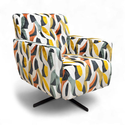 Angled view showing the chair's rounded shape and the patterned fabric.