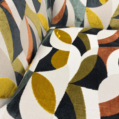 Close-up showing the detail of the patterned velvet fabric and stitching.